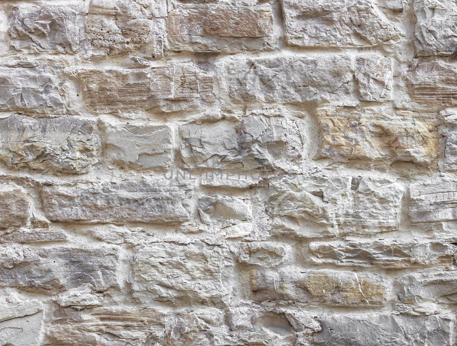 Texture of wall. Old wall made from bumpy stones.