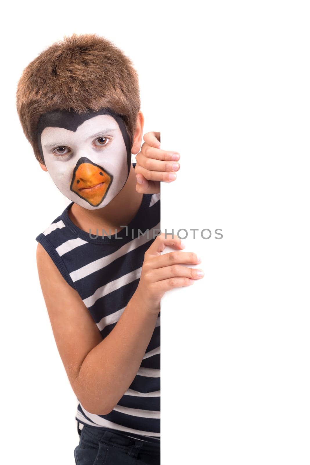 Boy with animal face-paint over a white board isolated in white