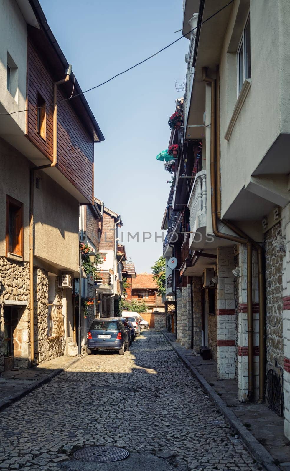 Nesebar, Bulgaria - September 10, 2014: Houses on the street of old town Nessebar in Bulgaria. Bulgarian Black Sea Coast. UNESCO world heritage site. Vertical shot.