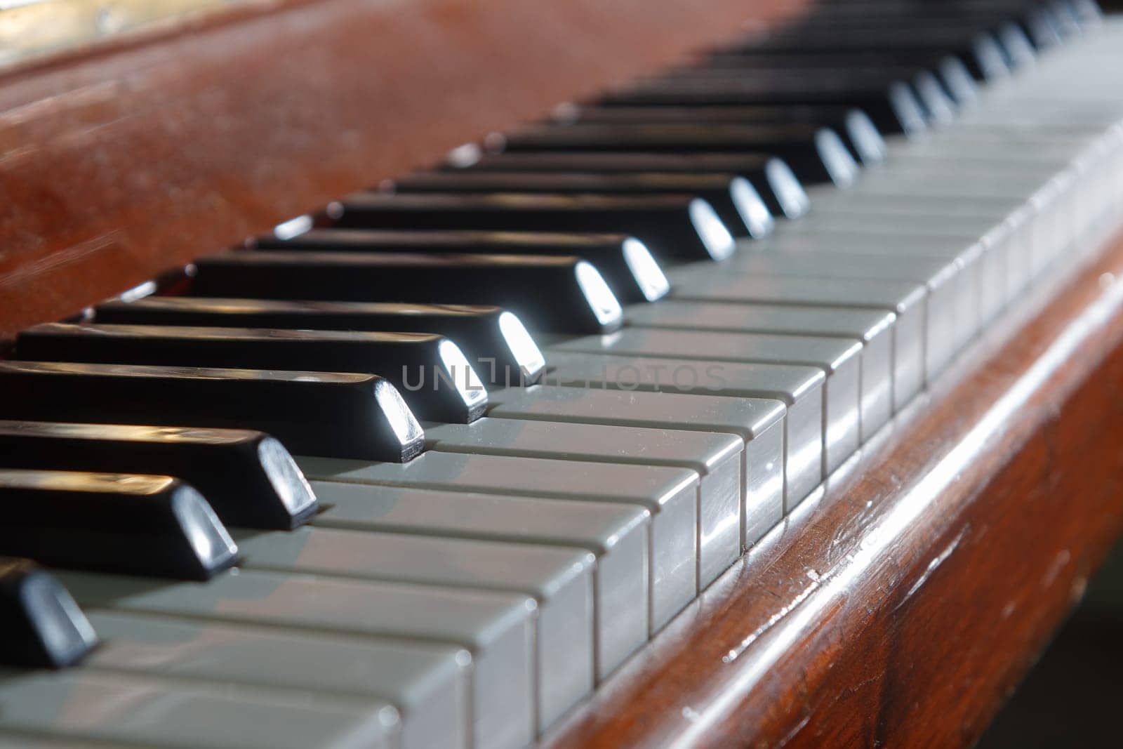 piano keys on an old wooden piano