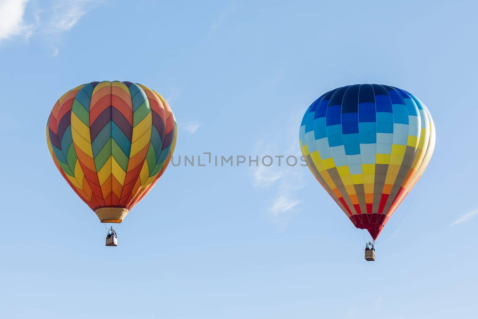 Multi colored hot air balloons on blue sky