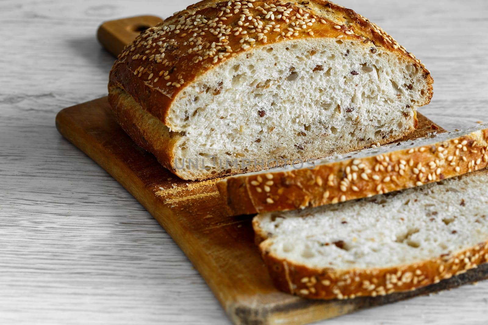 Bread with sunflower seed cutting board, slice on bread