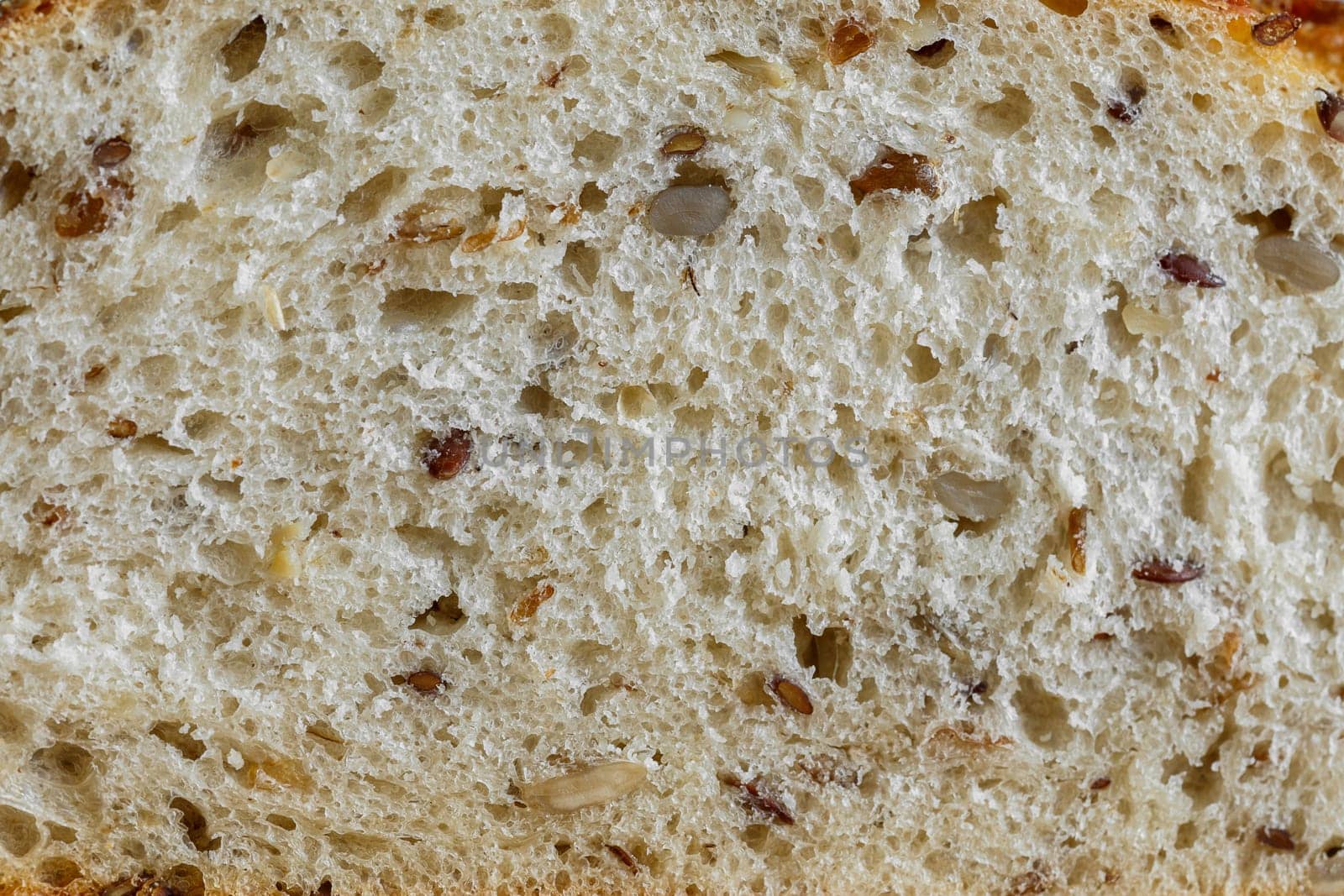 Bread with different seeds in the cut close-up