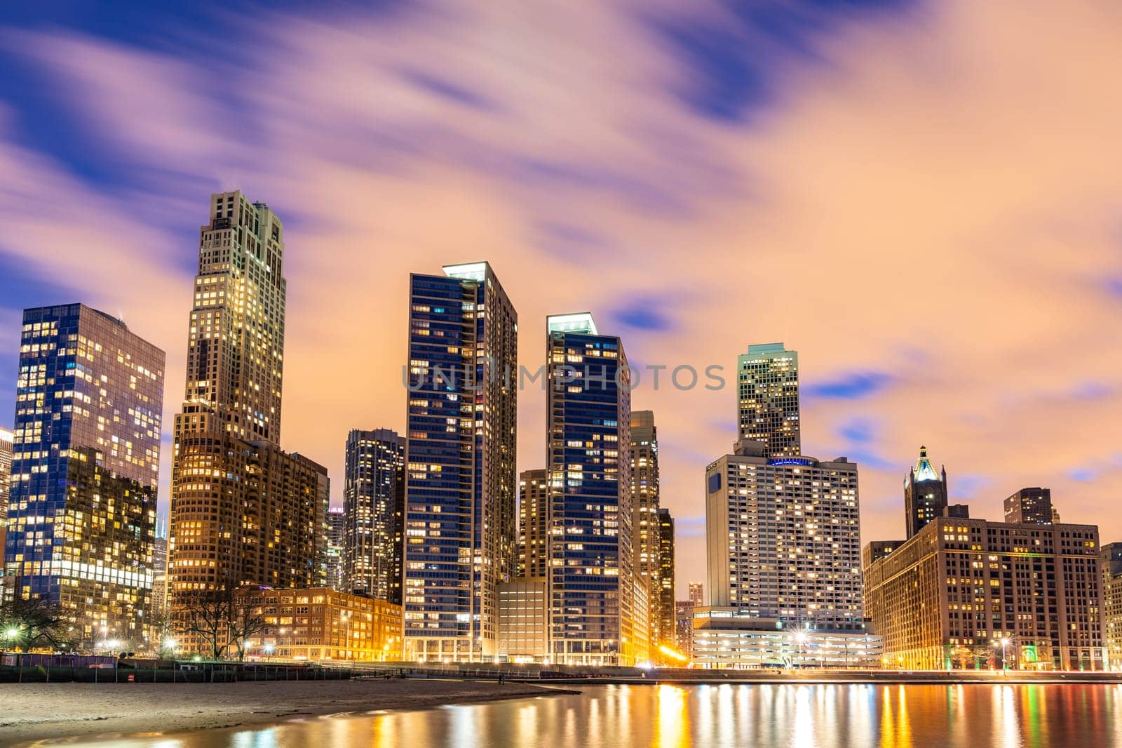 Sunset at Chicago Skylines building at Chicago downtown along Lake Michigan in Chicago City Illinois USA. Take from Ohio Street beach Milton Lee Olive Park.