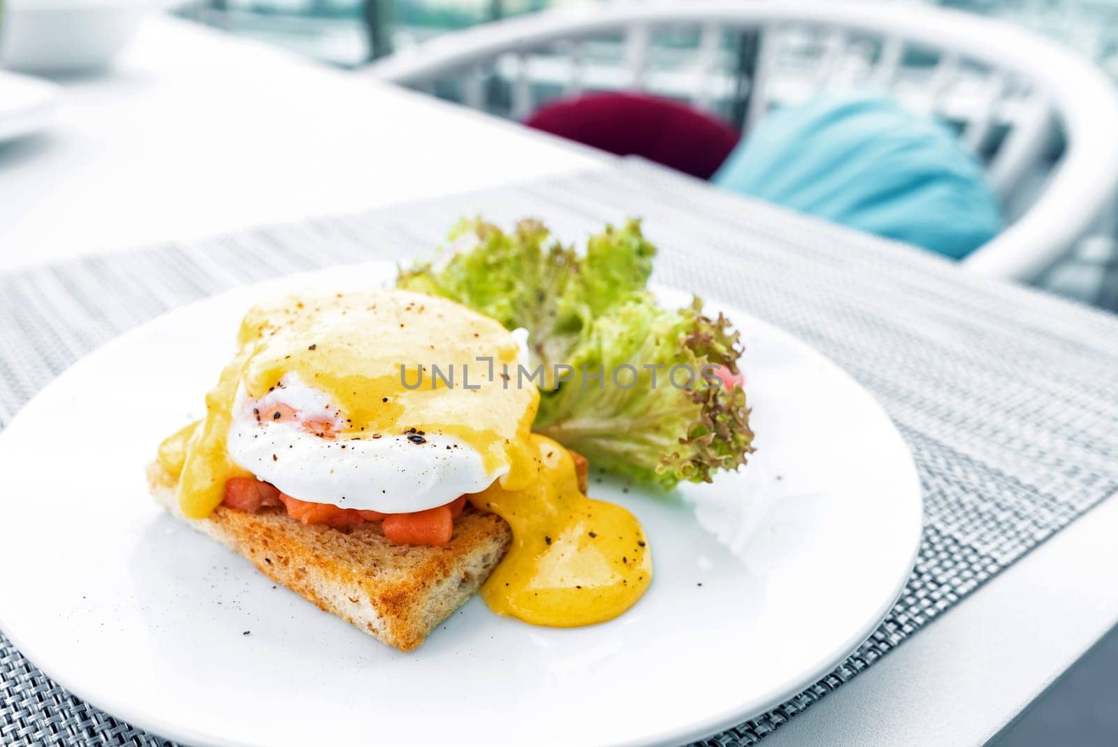 gourmet Salmon egg benedict in white plate
