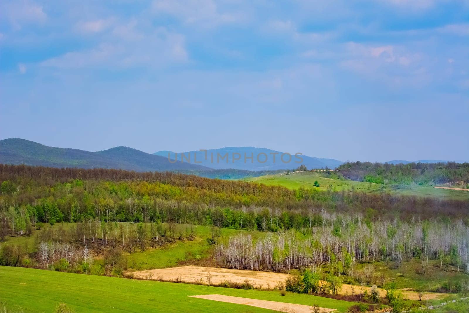 Carpathian mountains range under cloudy sky in Romania