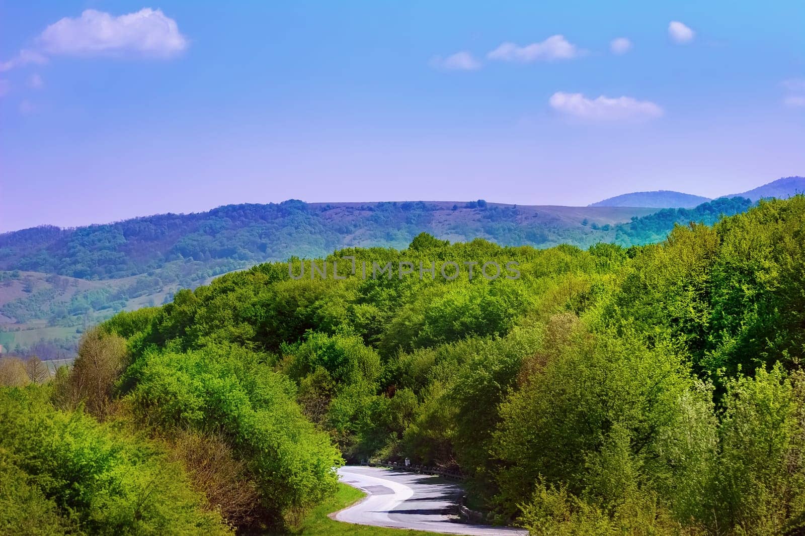 Carpathian mountains under blue sky in Romania
