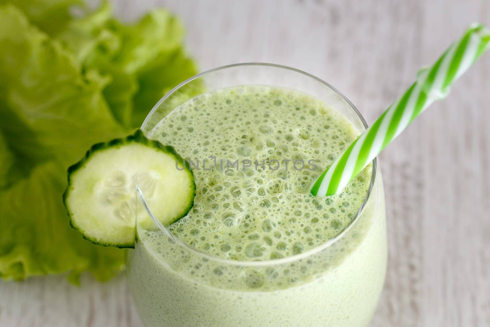 Smoothies from Greek yogurt with herbs on a gray background