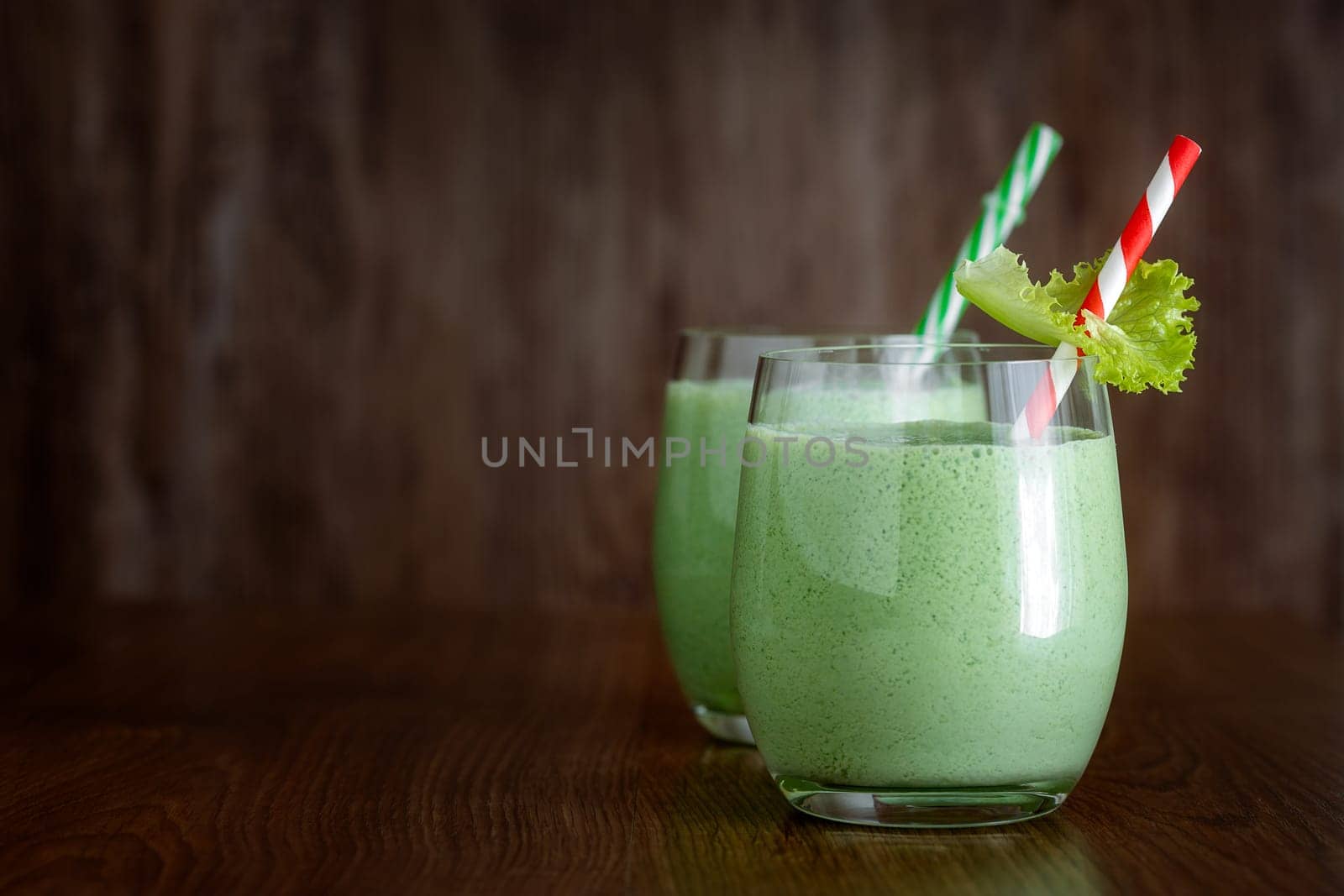 Greek yogurt smoothies with herbs on a dark background