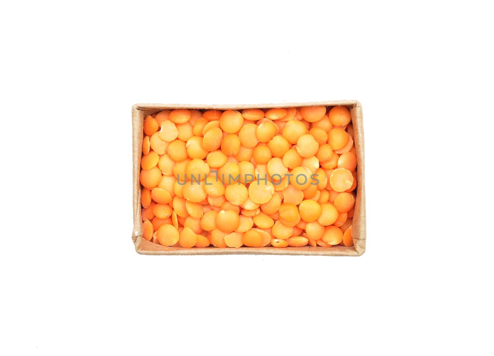 Red lentils in carton and white background