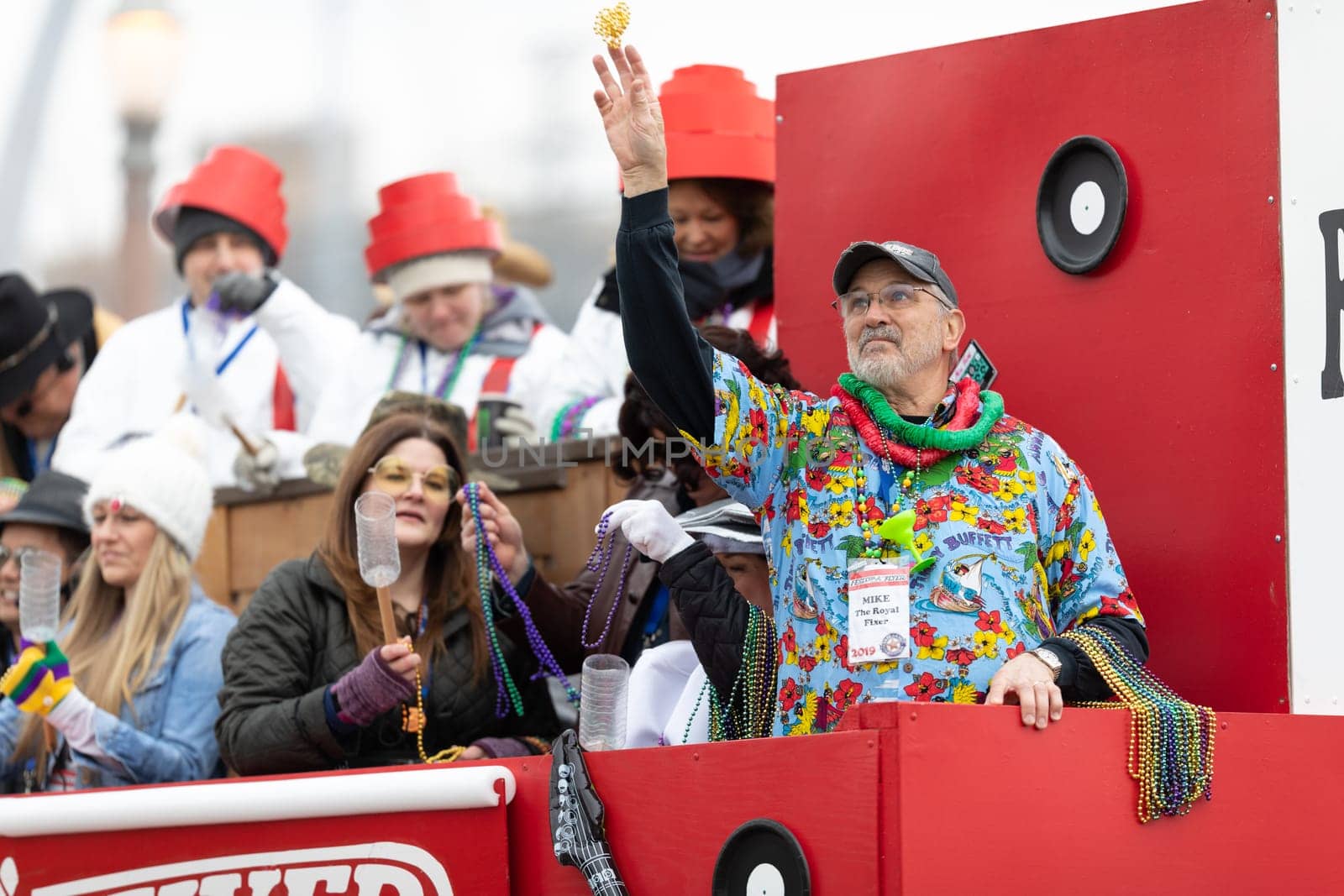St. Louis, Missouri, USA - March 2, 2019: Bud Light Grand Parade, Man on a float throwing beads to the spectators