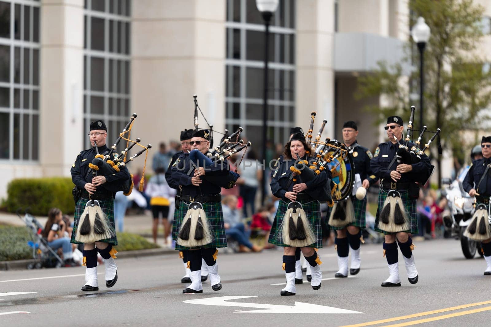 Wilmington, North Carolina, USA - April 6, 2019: The North Carolina.Azalea Festival, Members of the Wilmington's Police Force marching playing bagPipes during the parade