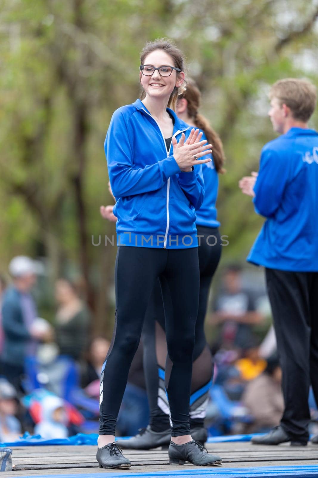 Wilmington, North Carolina, USA - April 6, 2019: The North Carolina.Azalea Festival, Members of the Cripple Creek Cloggers dance group, riding a trailer down 3rd street during the parade