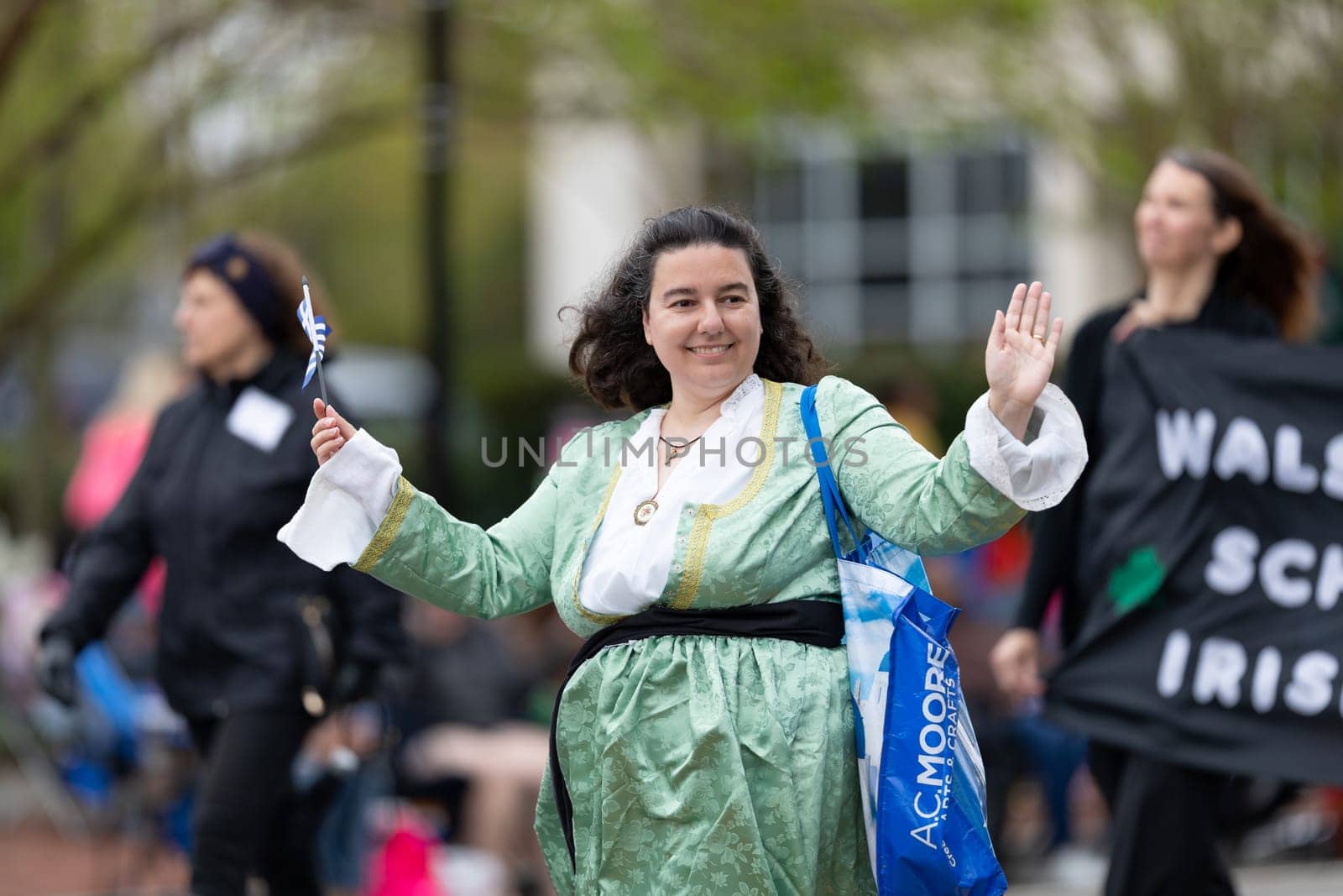 Wilmington, North Carolina, USA - April 6, 2019: The North Carolina.Azalea Festival, People of diferent cultures wearing traditional clothing going down 3rd street during the parade