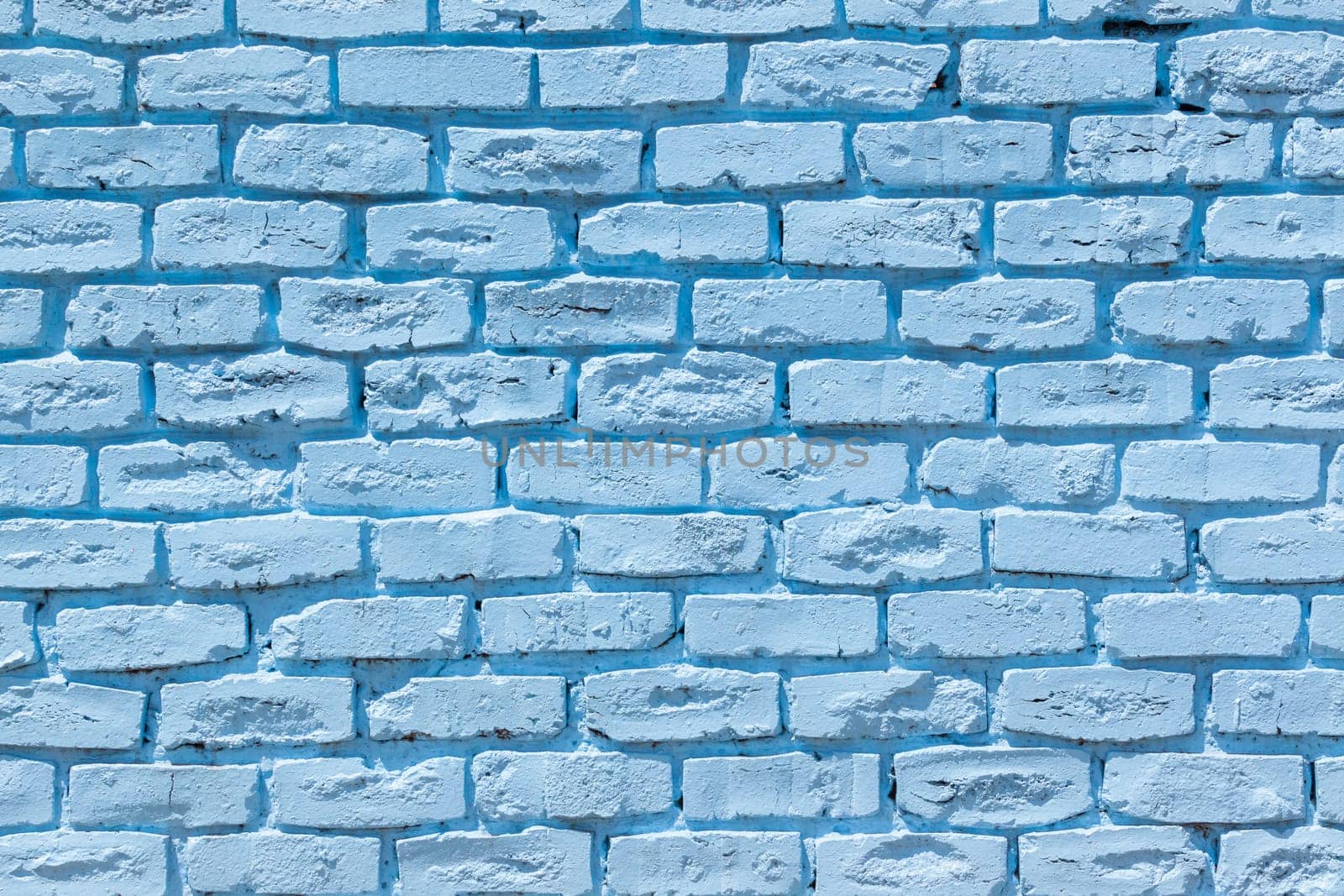 Brick wall painted blue outside decor texture detail color closeup background building structure..