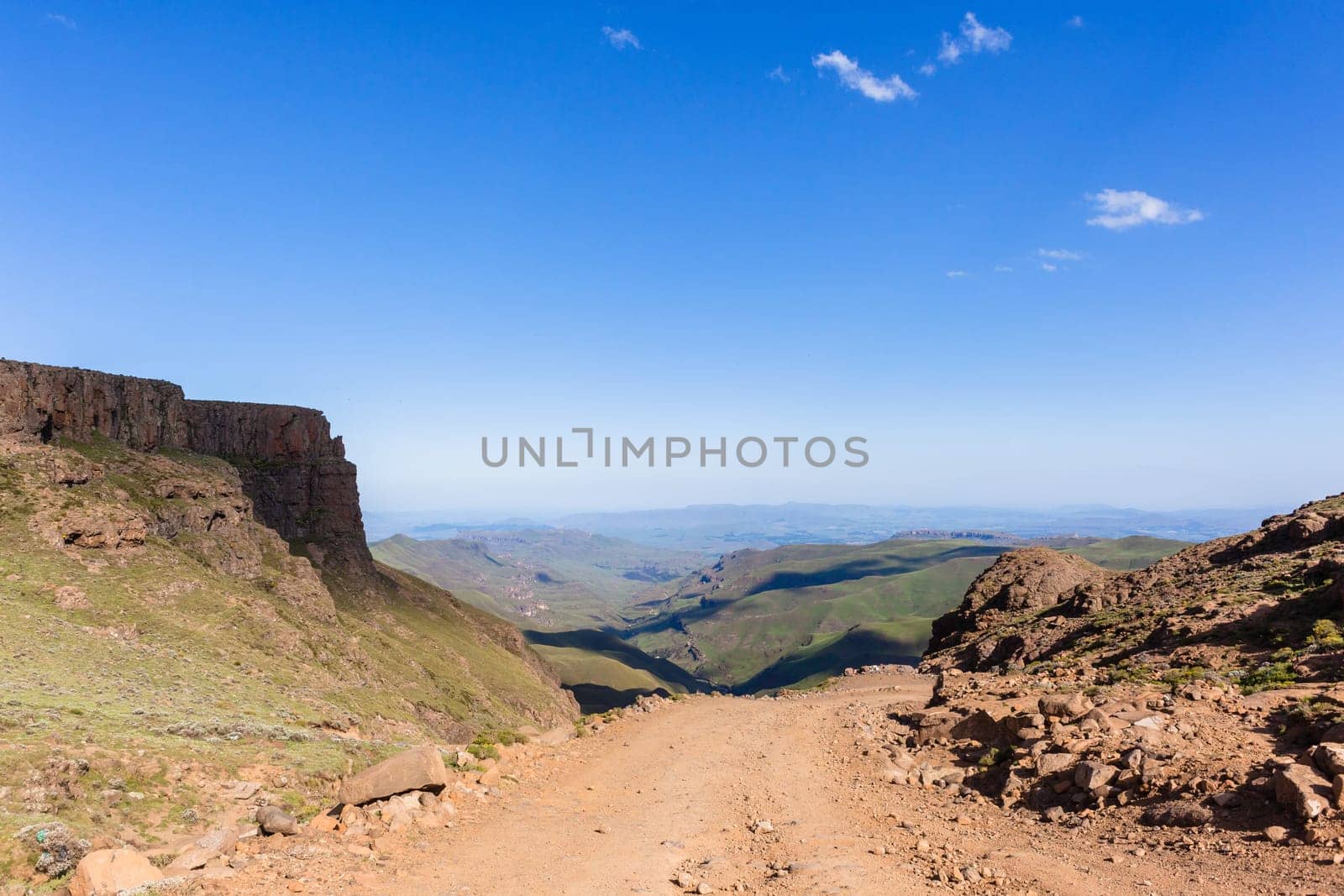 Mountain high dirt road pass from river valley up or down by four wheel vehicle  summer landscape