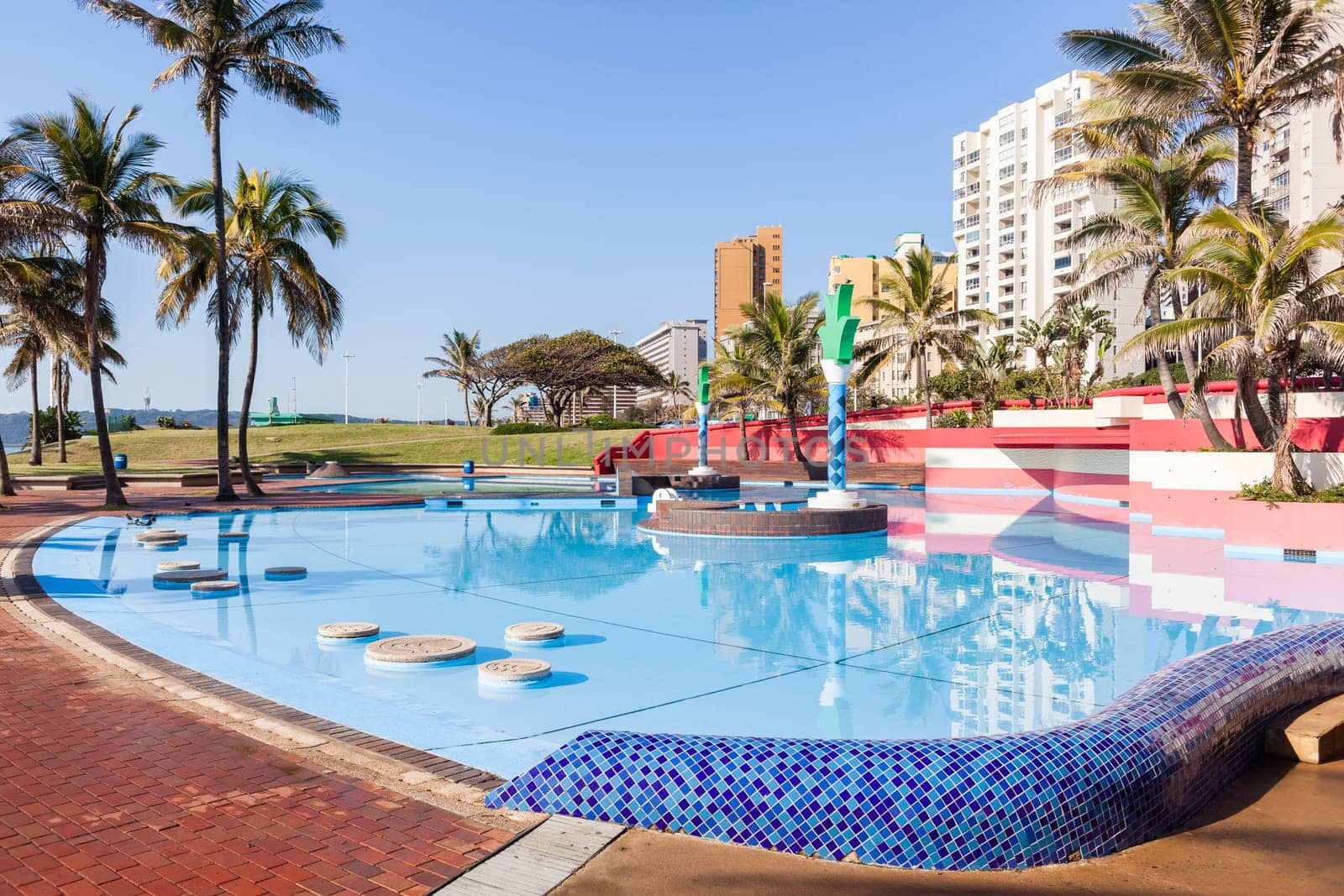 Swimming pool trees beach front public use scenic landscape