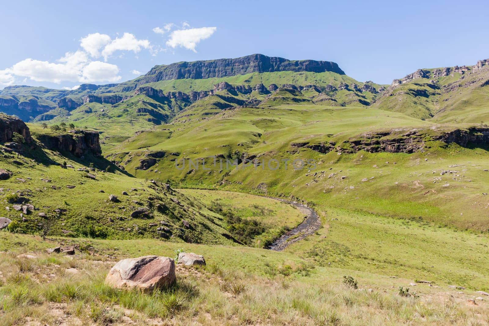 Mountains valley river rocky cliffs rural countryside scenic summer landscape.