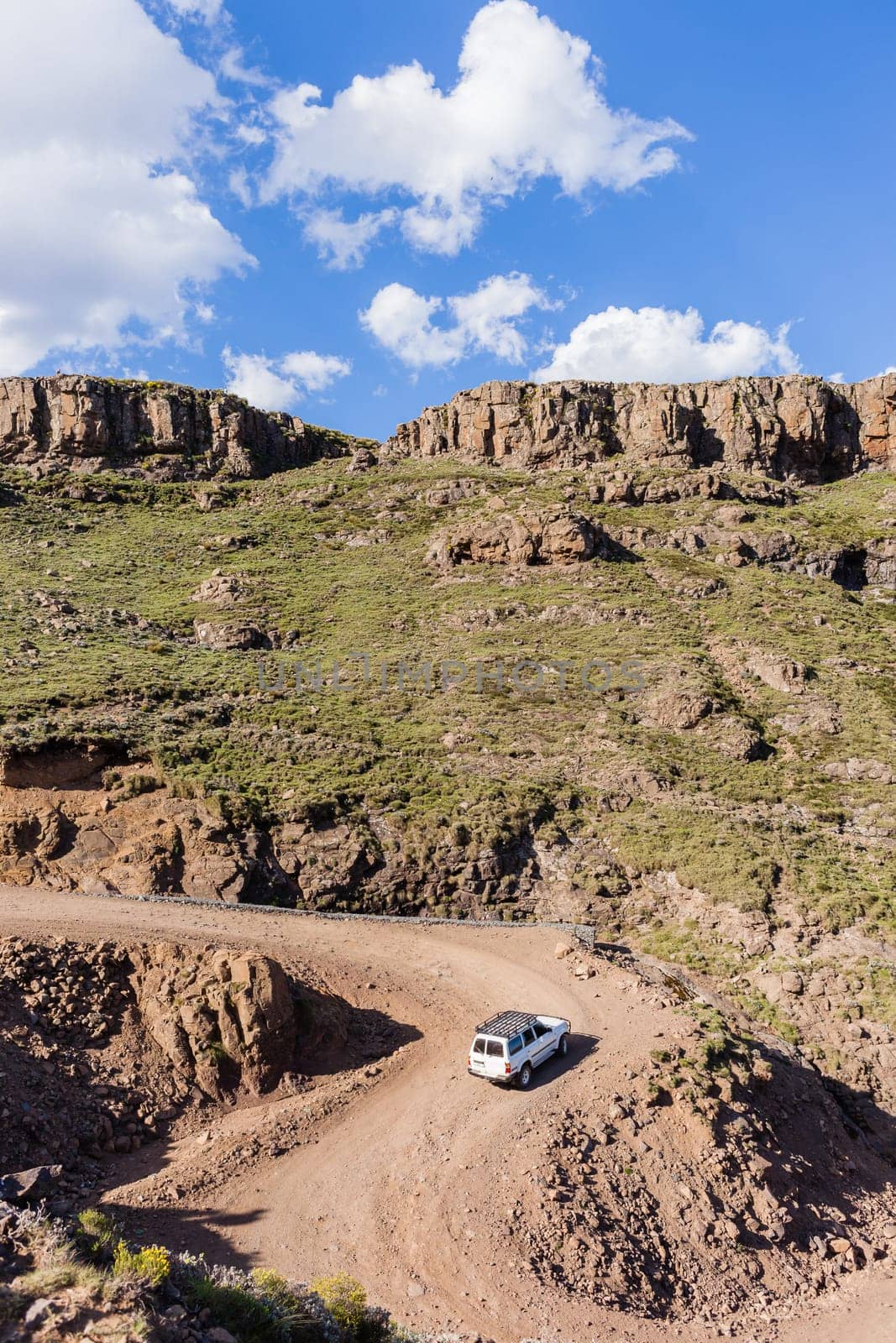Mountain high dirt road pass from river valley up or down by four wheel vehicle  summer landscape