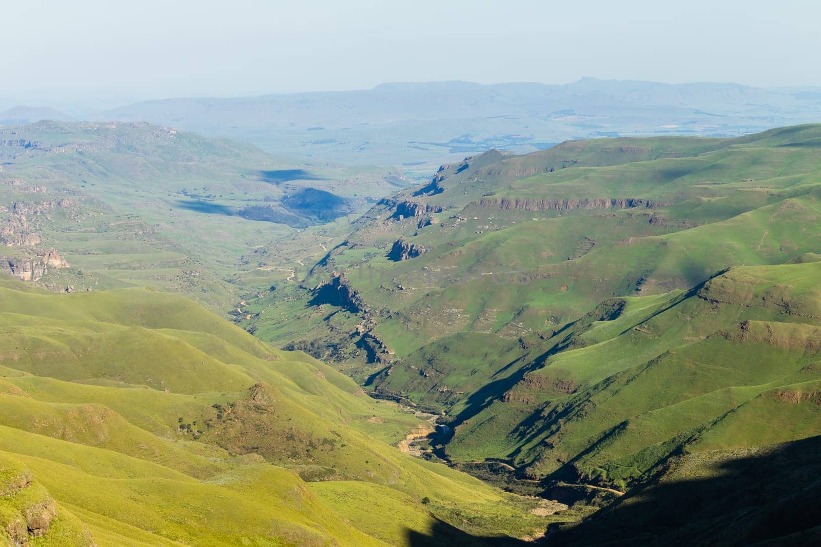 Mountains valley river rocky cliffs rural countryside scenic summer landscape.