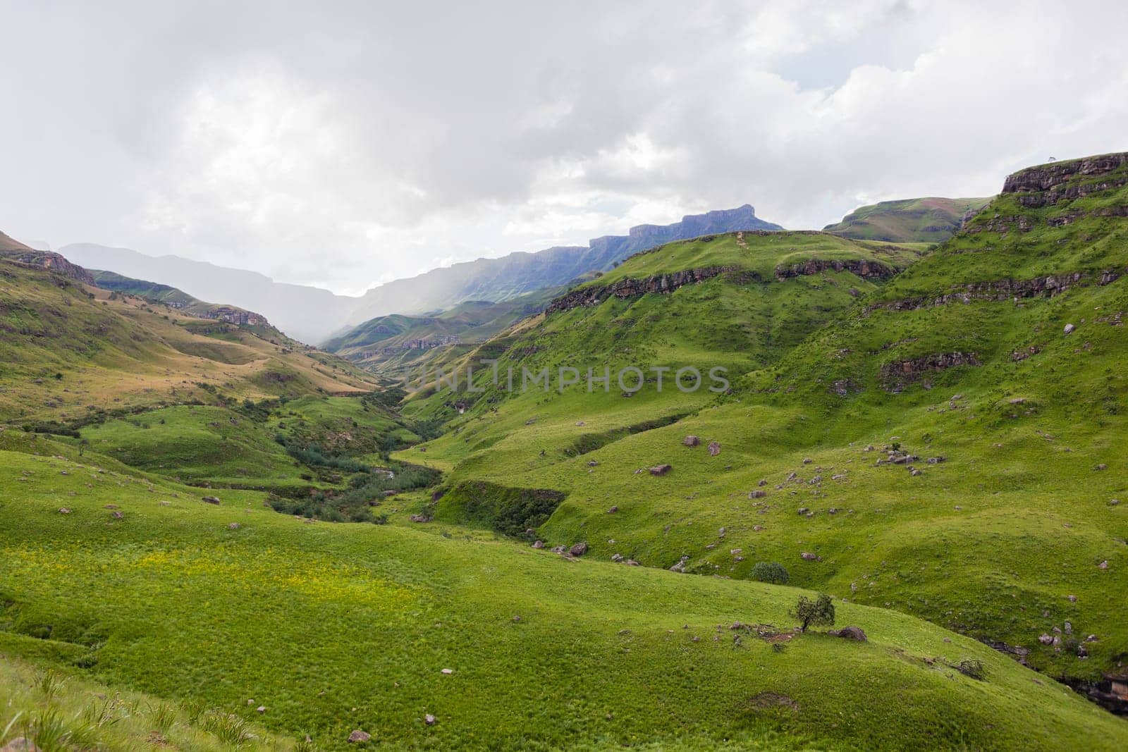 Mountains rock cliffs hills valley summer scenic rural landscape.