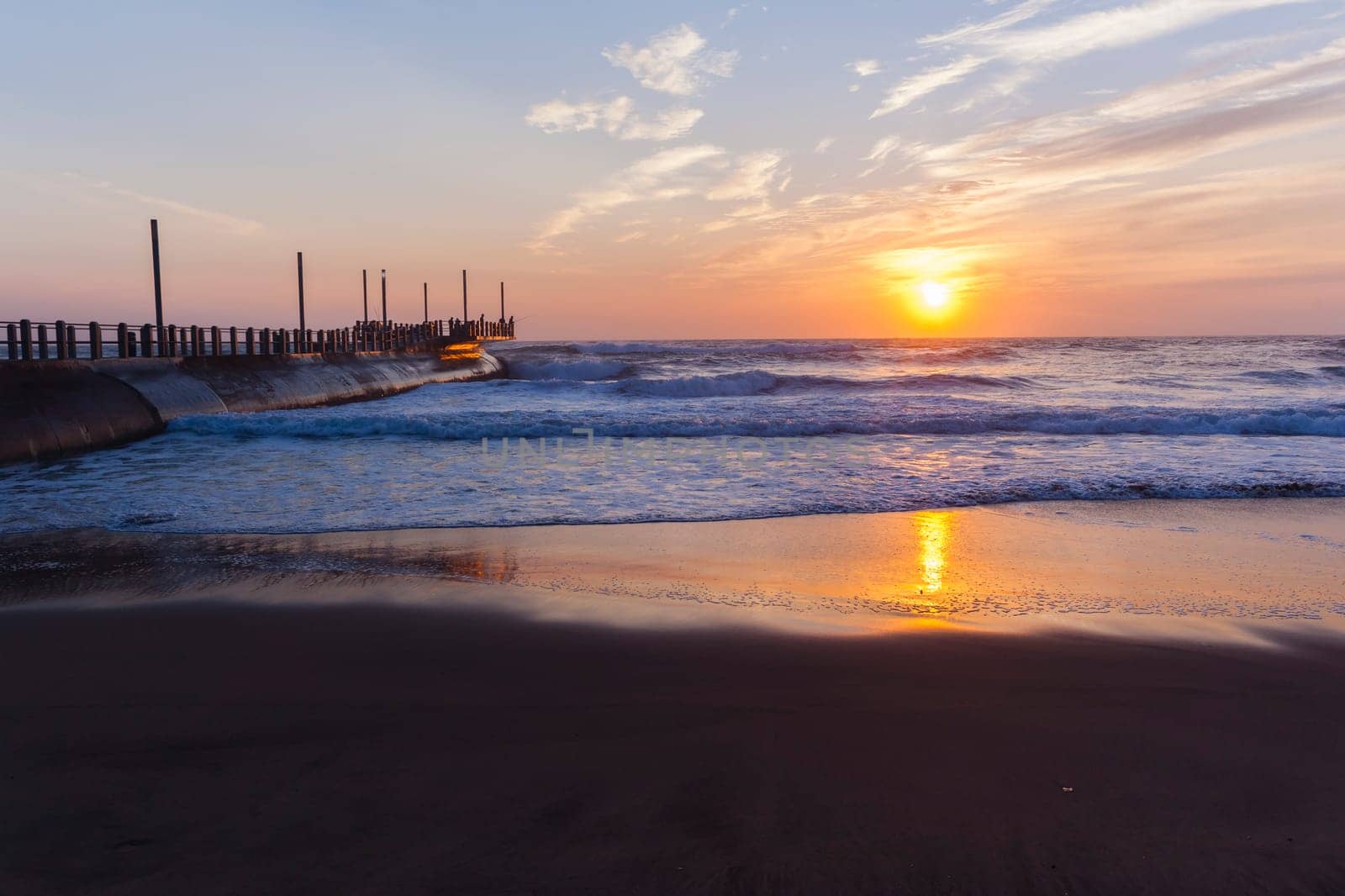 Beach ocean waves shoreline sunrise water sand color reflections horizon  skyline landscape