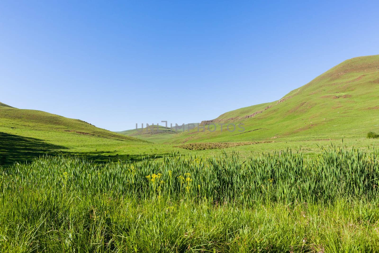 Mountains farmlands scenic valley plateau landscape late summer afternoon landscape..