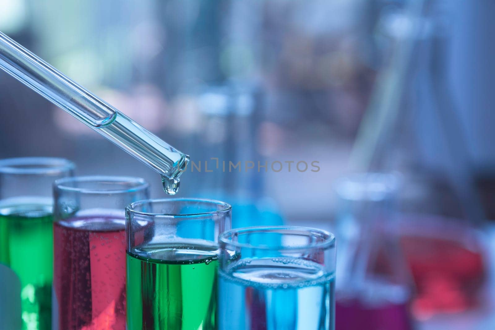 Glass laboratory chemical test tubes with liquid for analytical , medical, pharmaceutical and scientific research concept.