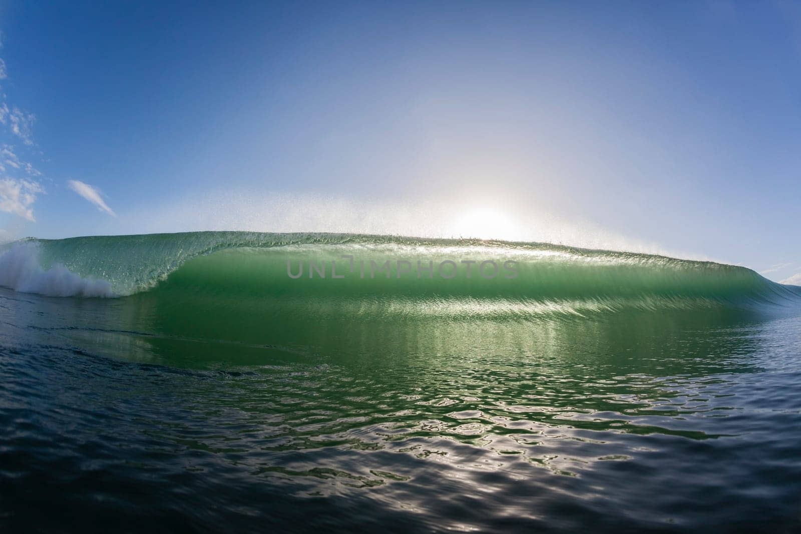 Wave ocean swimming encounter wall of water crashing breaking beauty nature power back-light closeup photo. .