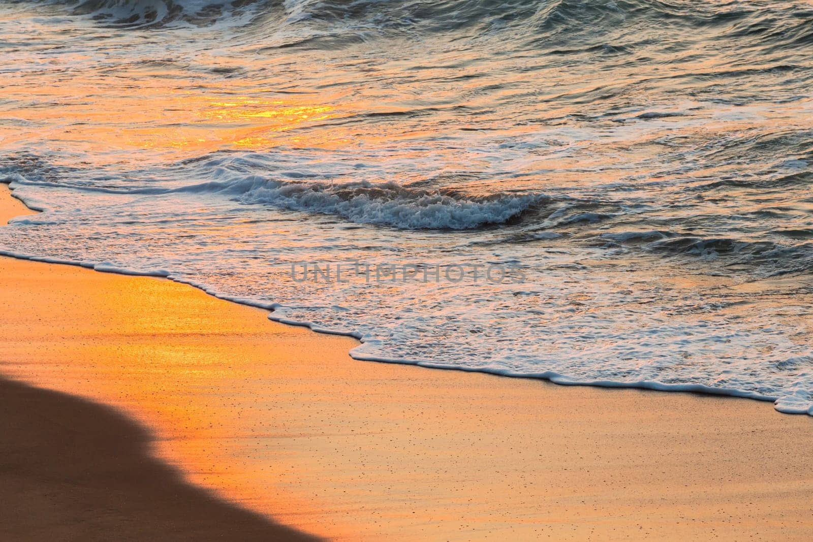 Beach sands waterline shoreline sunrise color mirror sunlight reflections of ocean water nature