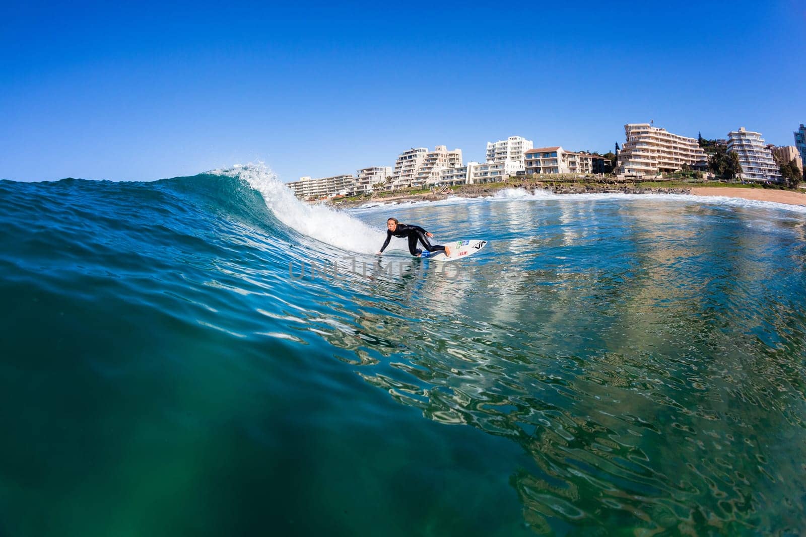 Girl Surfing surfer wave closeup water swimming action photo.