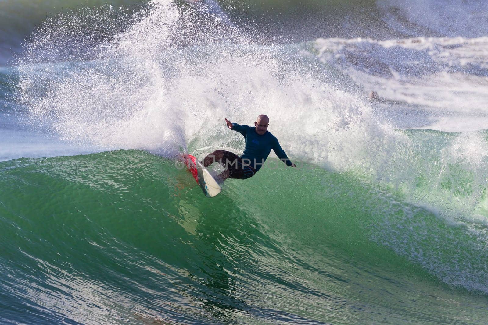 Surfing surfer closeup wave action water photo.