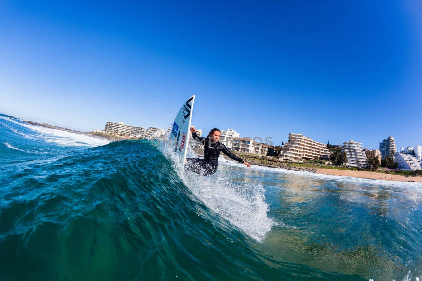 Girl Surfing surfer wave closeup water swimming action photo.