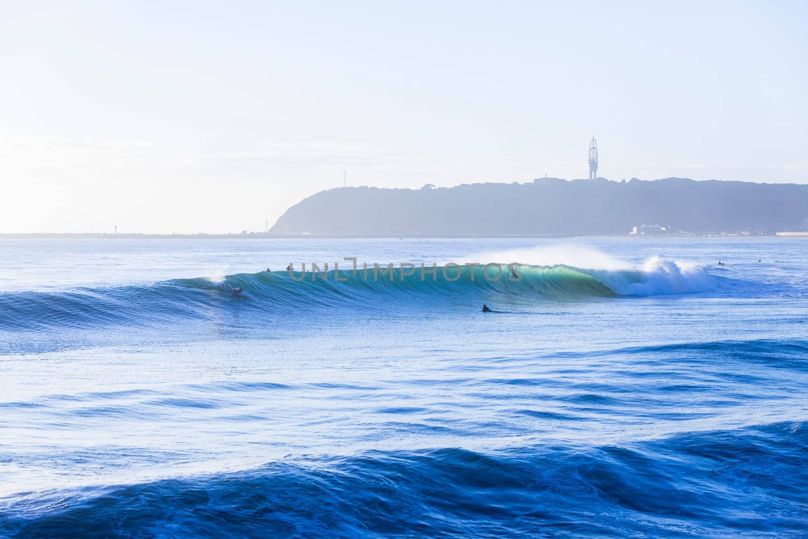 Surfing surfers waiting catching morning ocean large waves lifestyle landscape.