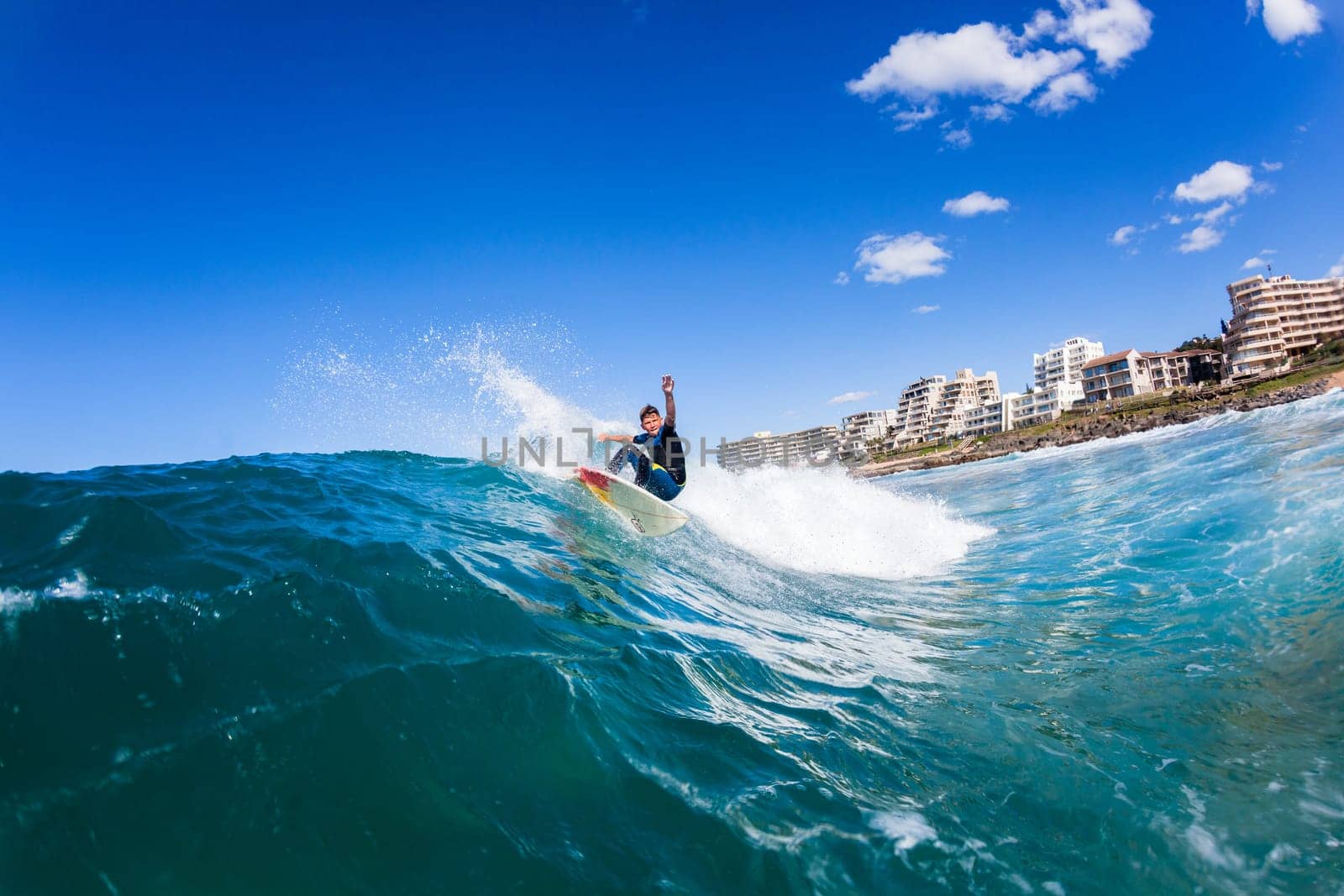 Surfing surfer closeup wave action water photo.