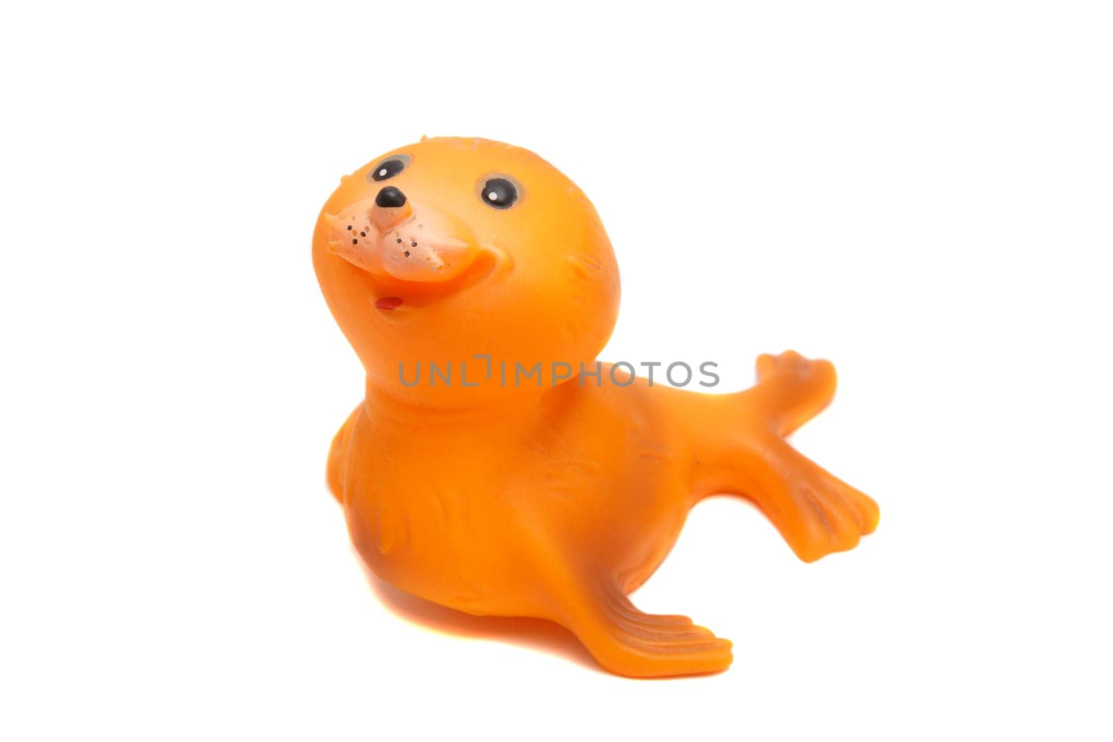 smiling seal toy on a white background