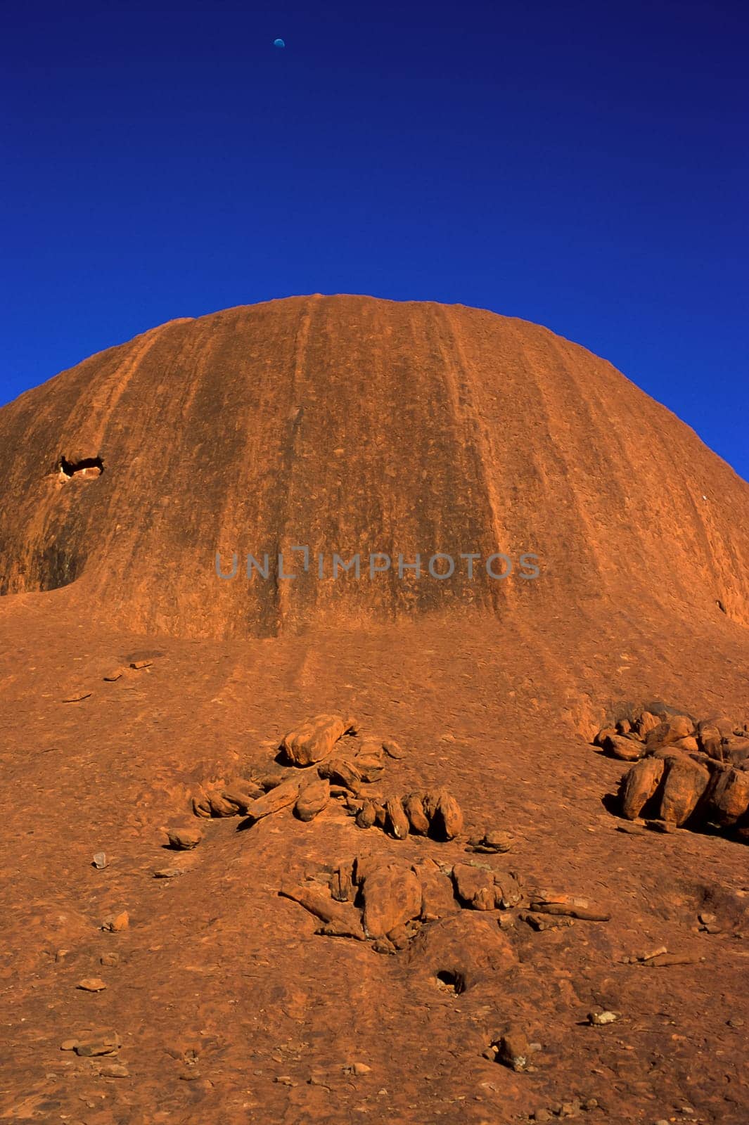 Sandstone boulders at the eastern side of Uluru (Ayers Rock), at early morning as seen along the base of the large monolith, Uluru-Kata Tjuta National Park , Northern Territory, Australia