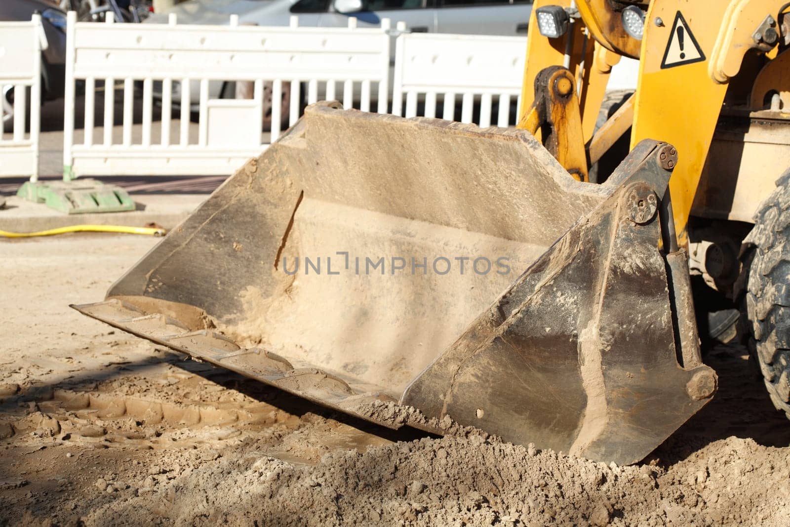 Excavator with excavator bucket on a construction site