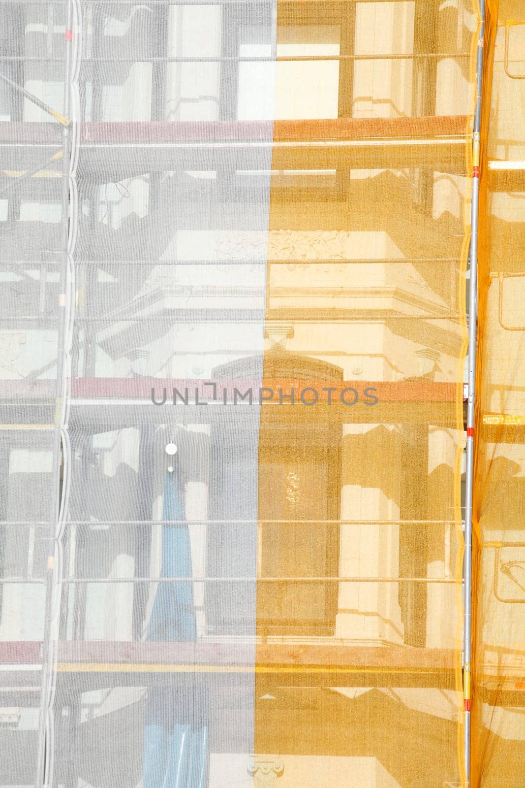 Orange-white tarpaulin, gable, scaffolding, construction site, house facade, old building, Germany, Europe