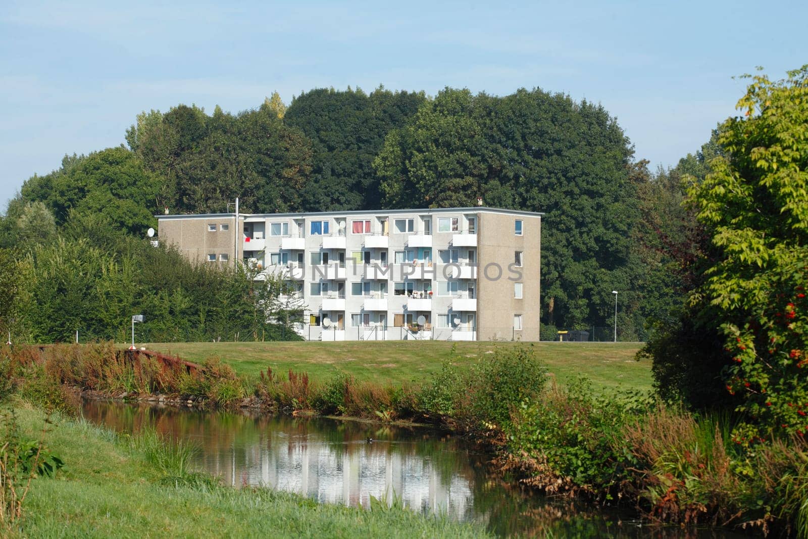 Residential house, apartment building, park with water, Bremen, Germany