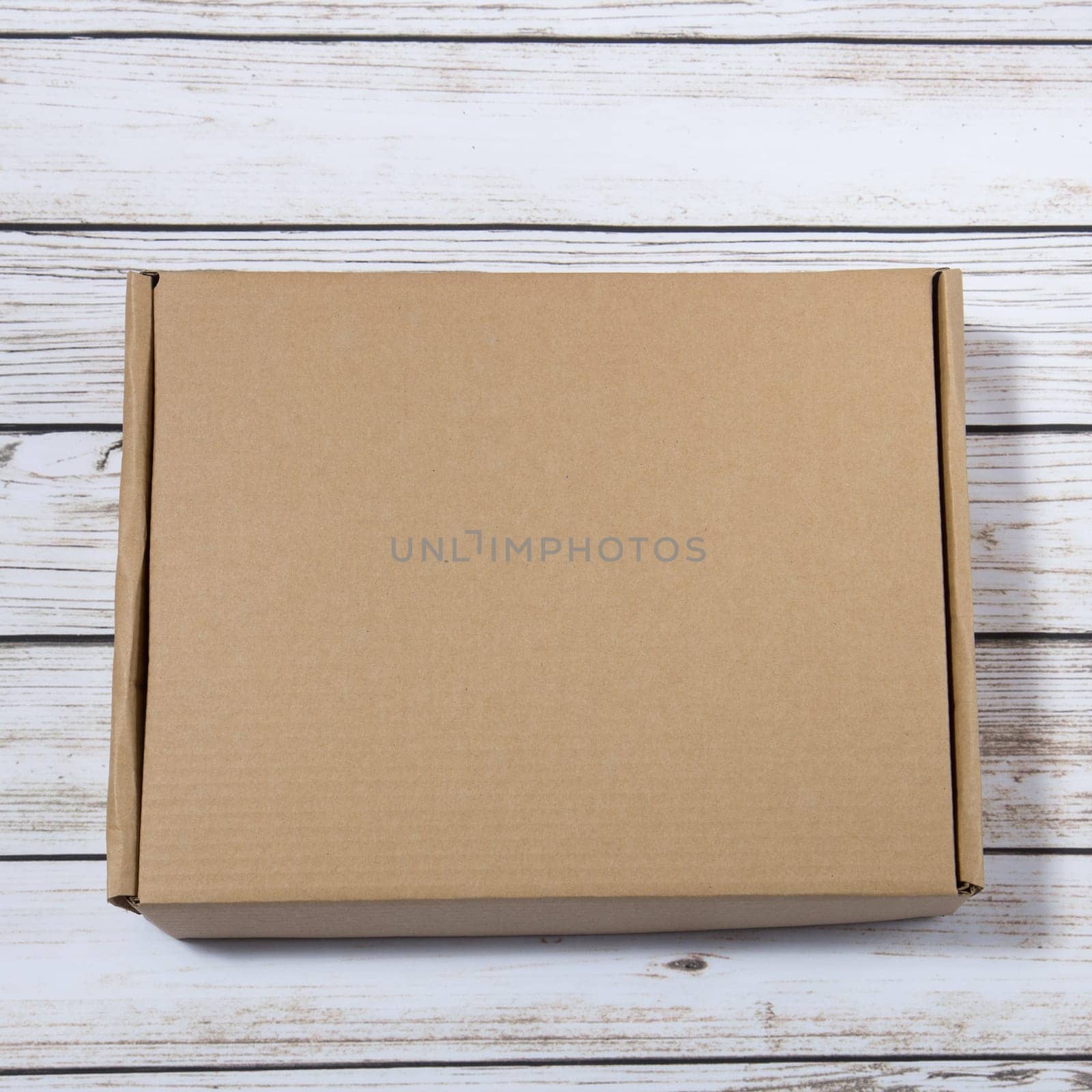 plain cardboard box on a wooden background