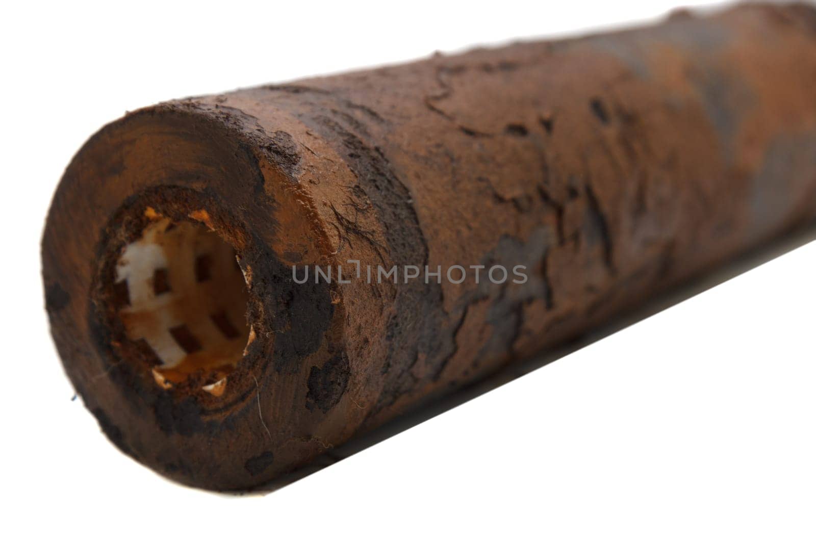 very dirty rusty water filter on white background