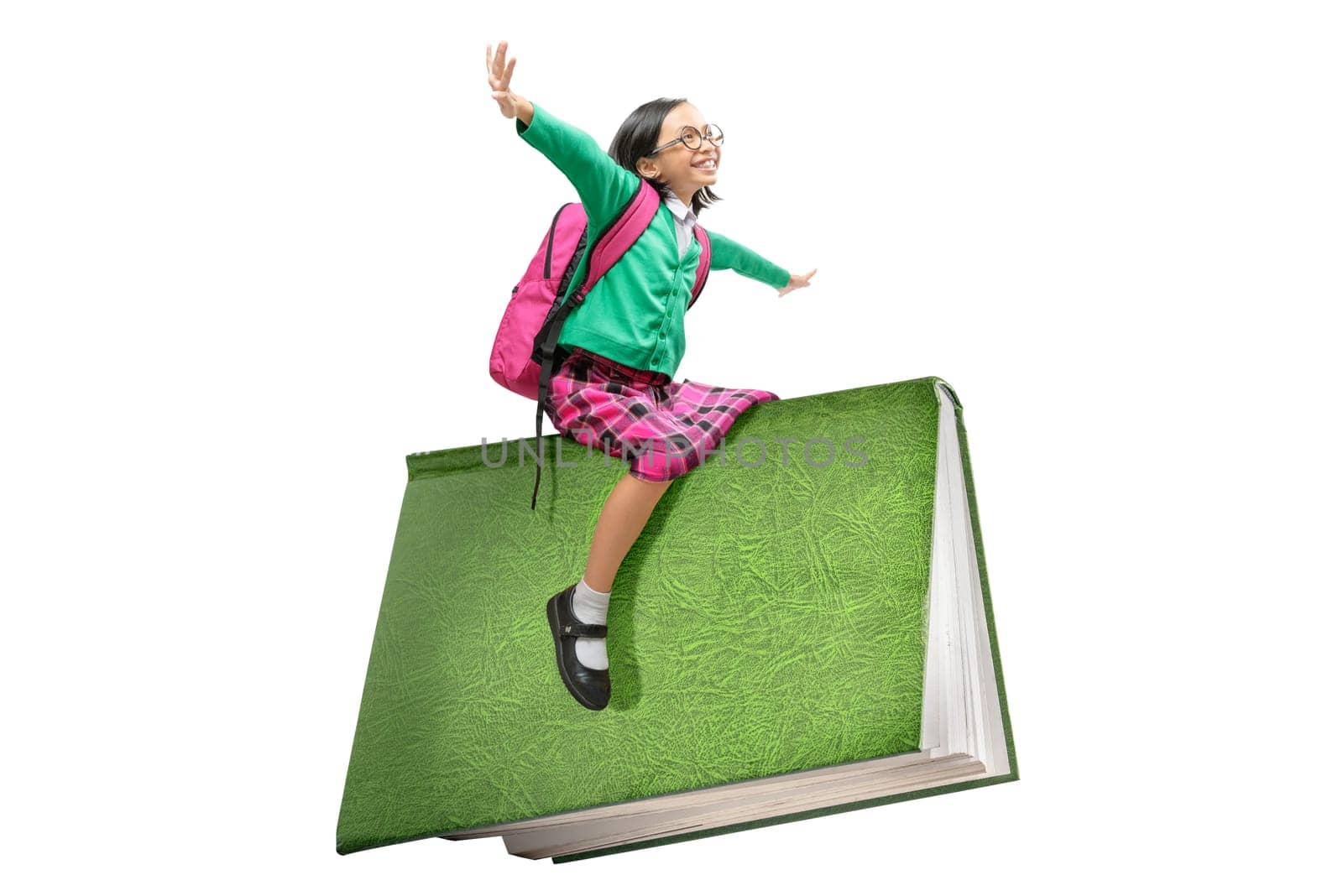 Asian cute girl with glasses and backpack sitting on book isolated over white background. Back to School concept