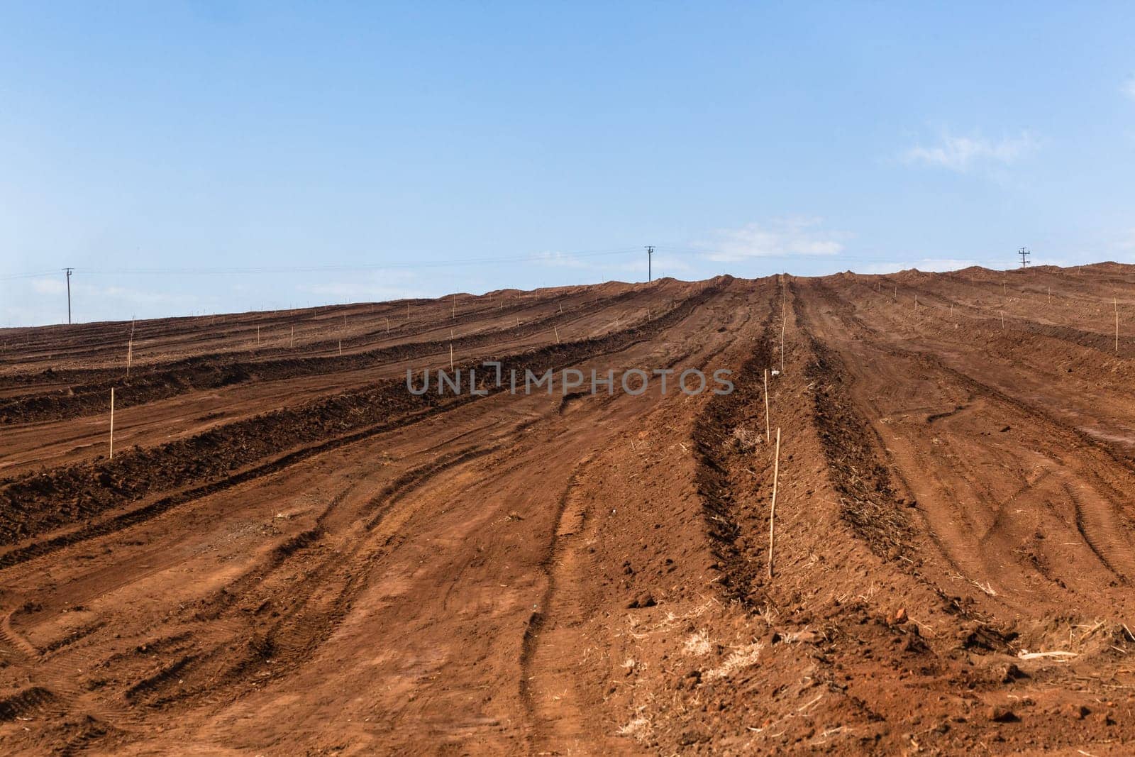 Farm field closeup tractor plowed earth soil detail agriculture background