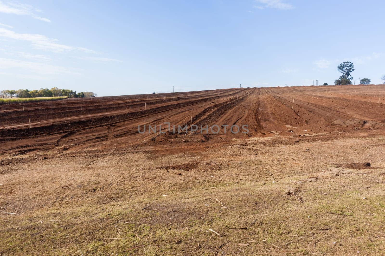 Farm field closeup tractor plowed earth soil detail agriculture background