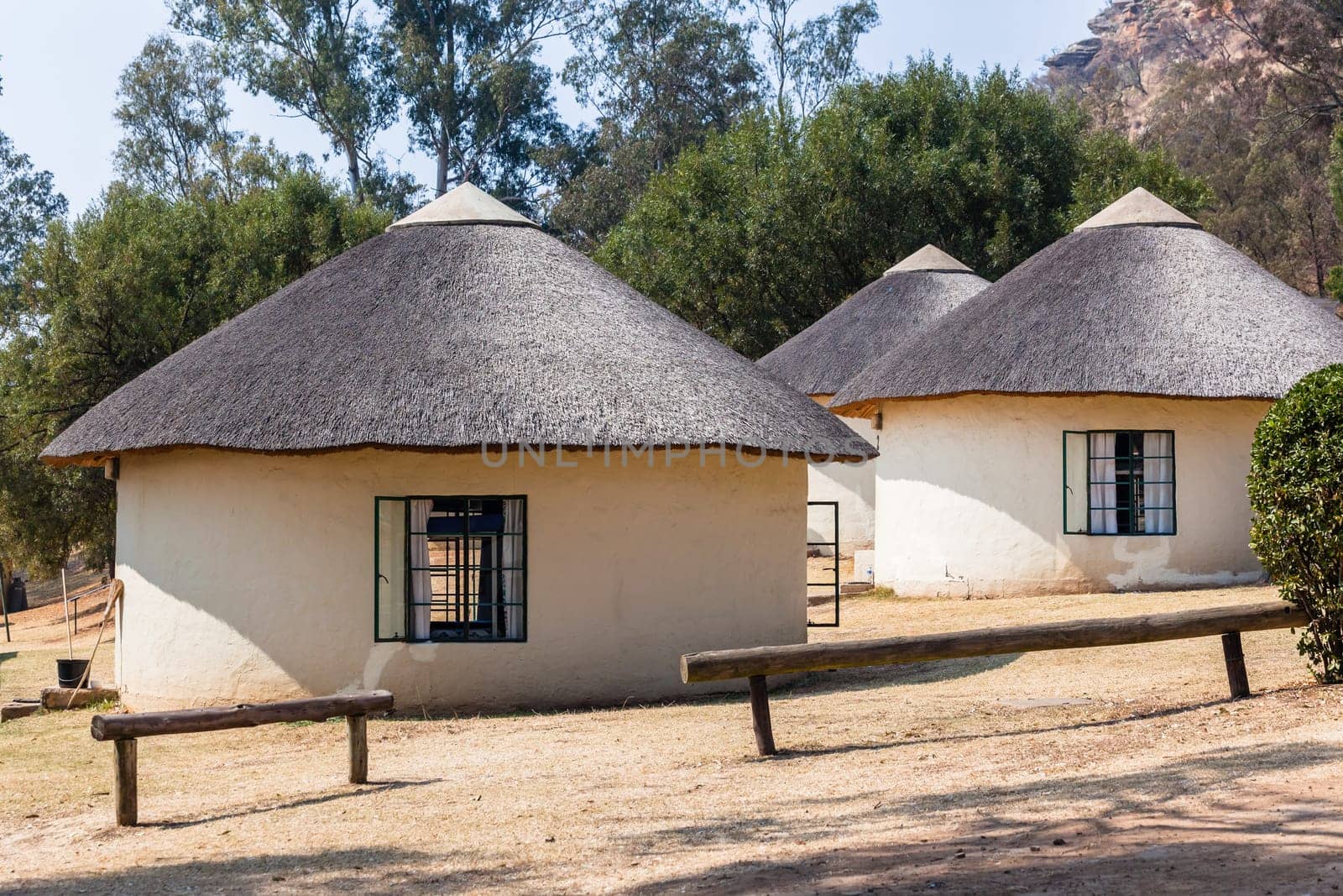 African style thatch grass  roofs round bungalow cottages buildings  holiday camps in rural mountains.