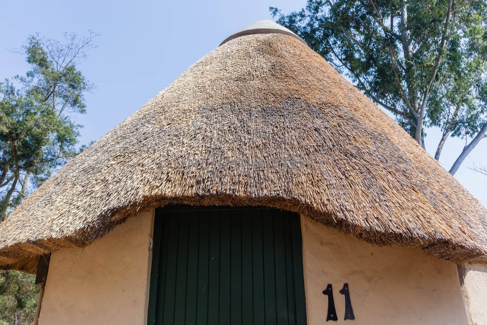 African style thatch grass  roofs round bungalow cottages buildings  holiday camps in rural mountains.