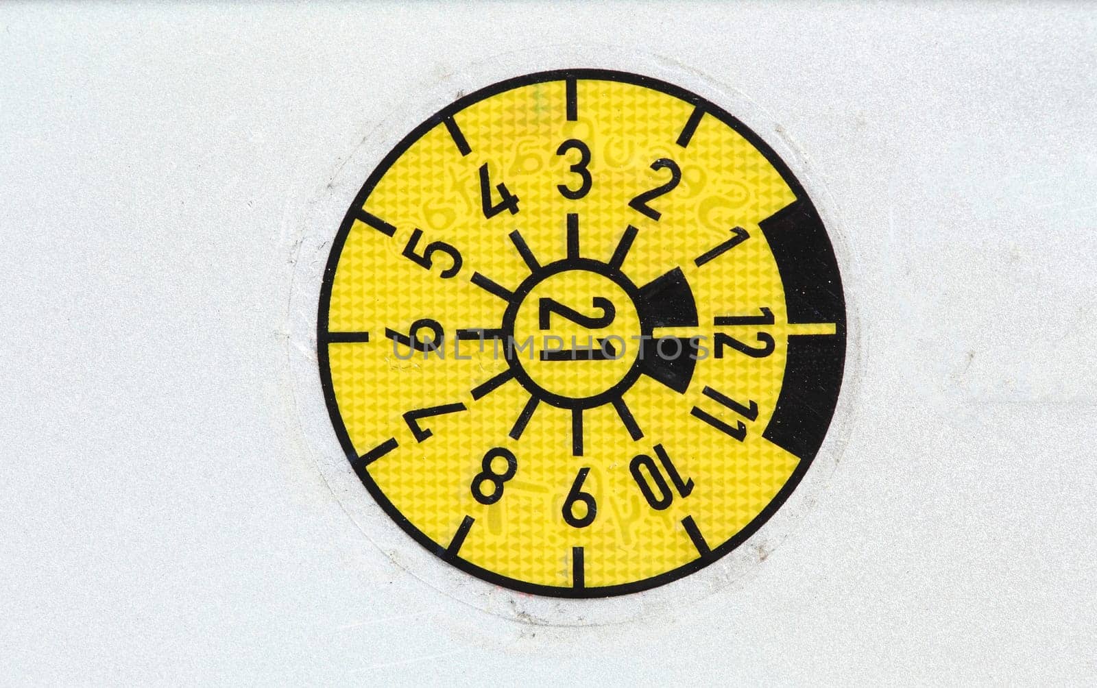 Yellow TÜV sticker, white background, Germany