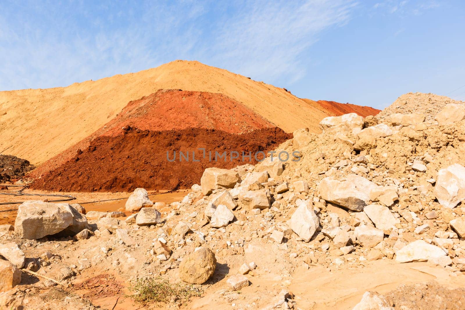 Earth sand mounds embankments of soil colors on industrial project construction landscape