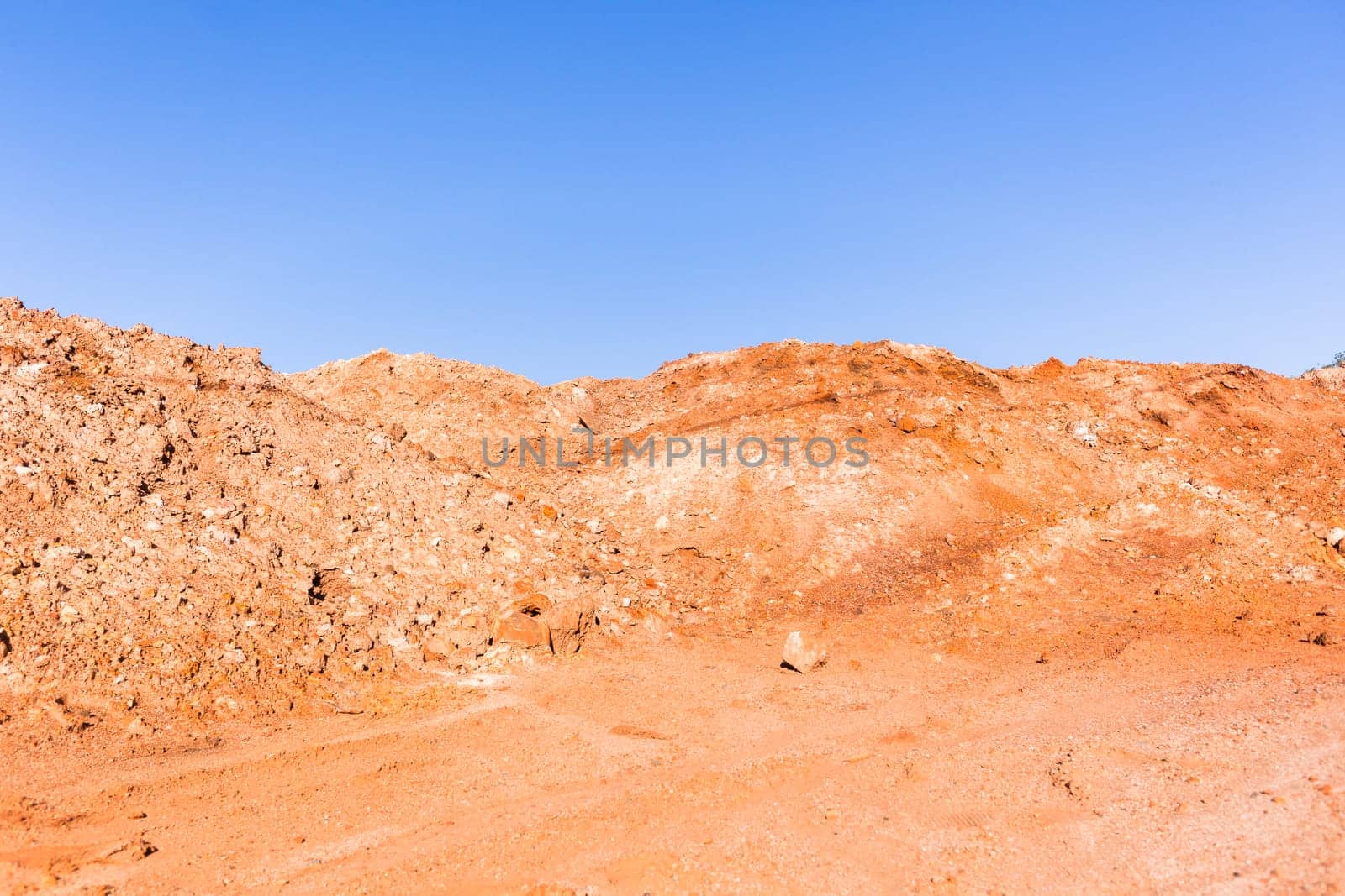 Earth sand mounds embankments of soil colors on industrial project construction landscape